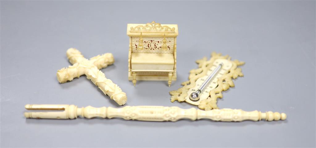 A group of decorative ivory and bone objects to include a 19th century Anglo-Indian carved bone miniature model / dolls house piano, 5